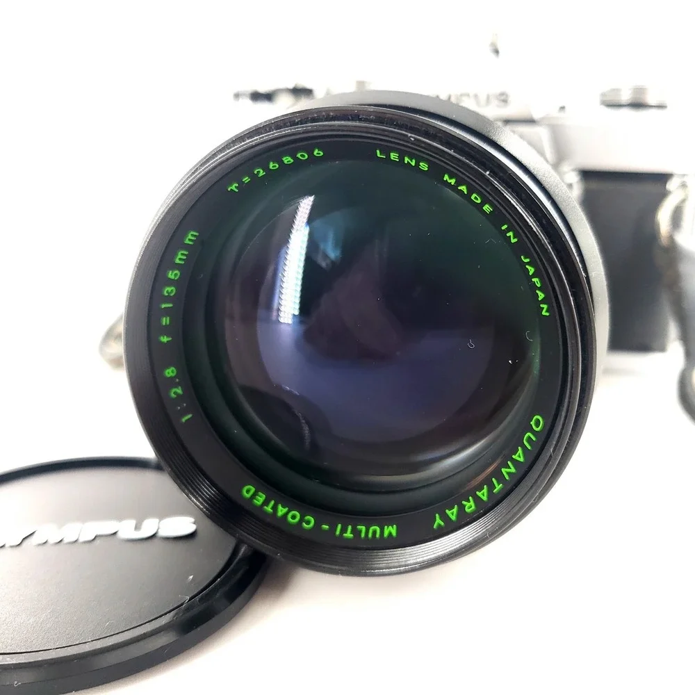 Olympus OM 1 35mm SLR Film Camera with 75-150mm Lens w/ Quantaray 135mm f/2.8